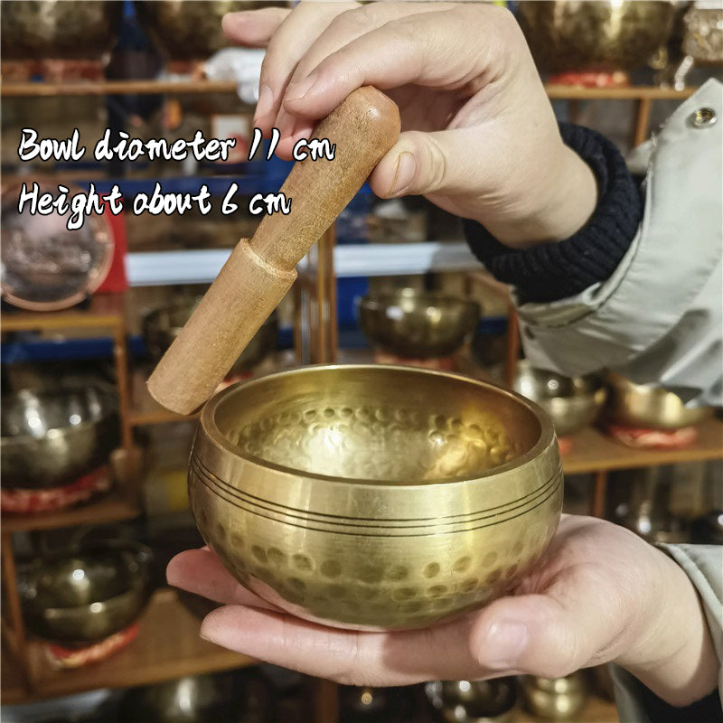Tibetan brass singing bowl with Sanskrit – handmade meditation instrument for stress relief.