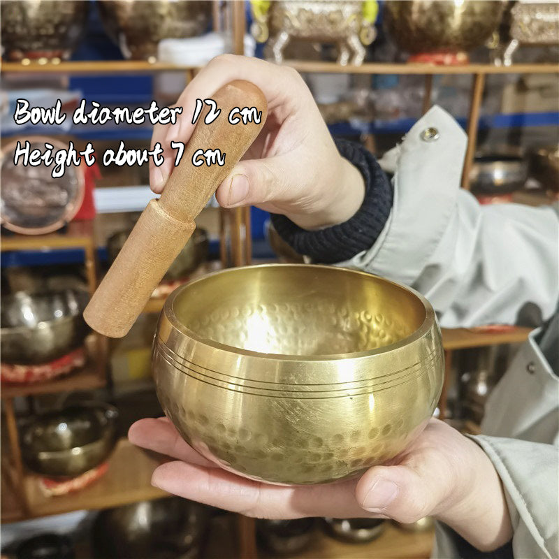 Tibetan brass singing bowl with Sanskrit – handmade meditation instrument for stress relief.