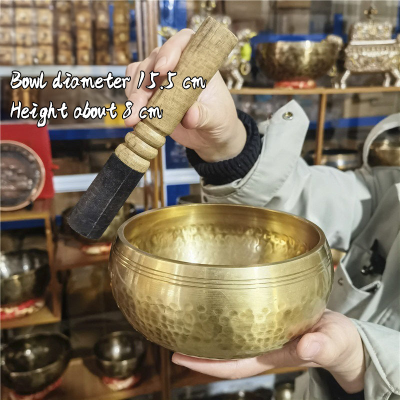 Tibetan brass singing bowl with Sanskrit – handmade meditation instrument for stress relief.